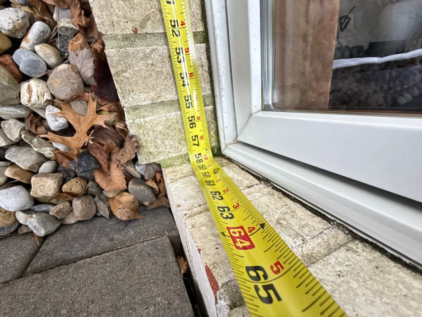 Storm-damaged window documented in Trader's Point